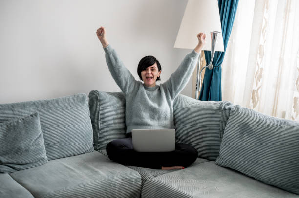 istock Young woman is resting on a sofa 1364573823