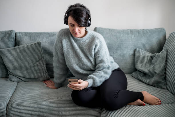 istock Young woman is resting on a sofa 1364574520
