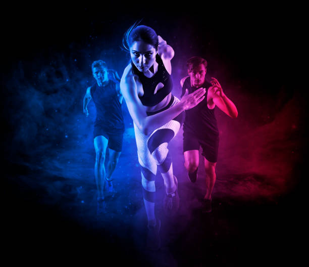 istock Sporty young woman and men running 1364574591