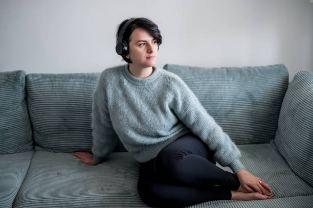 istock Young woman is resting on a sofa 1364574770