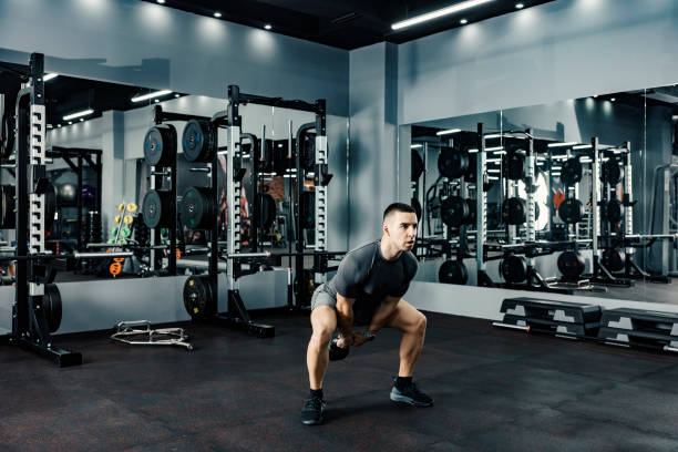 istock A bodybuilder swinging kettle-bell in a gym. Exercise with kettle-bell. 1364580982