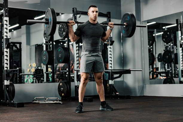 istock A muscular bodybuilder doing strength exercises with weights in a gym. 1364581139