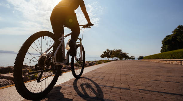 istock Riding bike on the sunrise coast path 1364581146