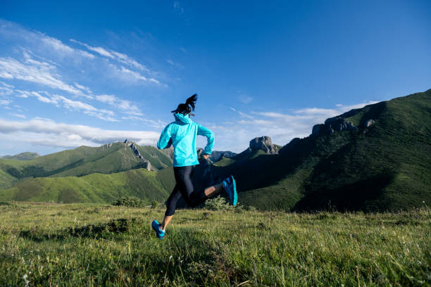 istock Young woman ultramarathon runner running at mountain top 1364582992