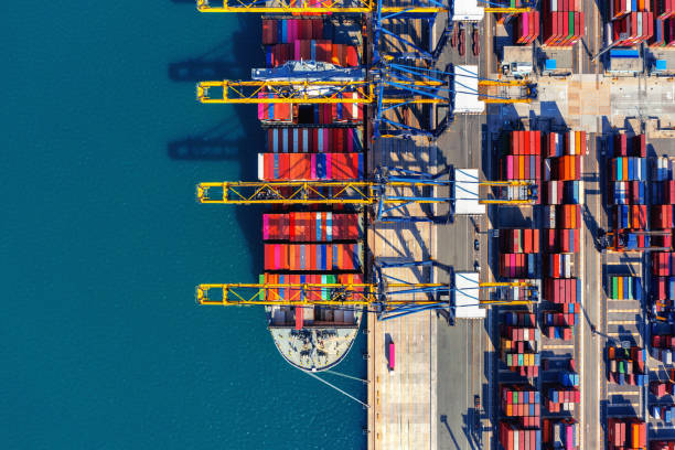 istock Aerial view of cargo ship and cargo container in harbor. 1364586151