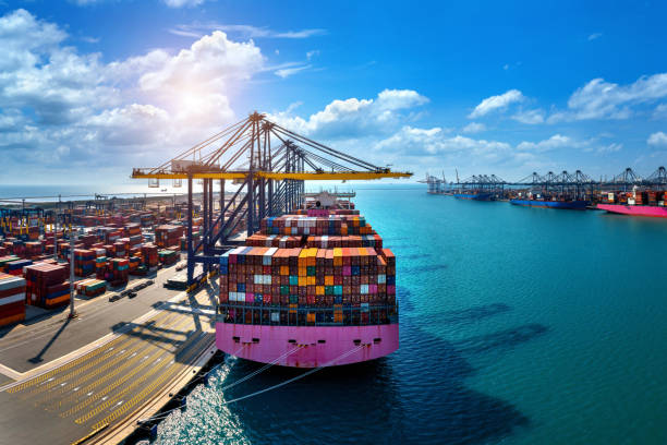 istock Aerial view of cargo ship and cargo container in harbor. 1364586175