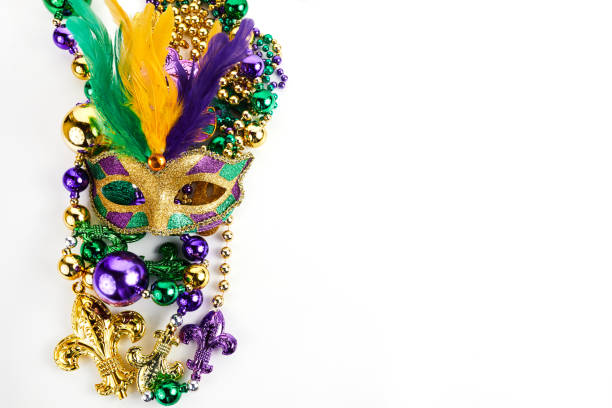 istock Frame of Mardi Gras mask and beads isolated on white background. 1364586454