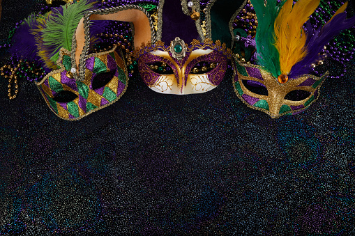 Mardi Gras Mask and colorful Mardi Gras Beads Background.