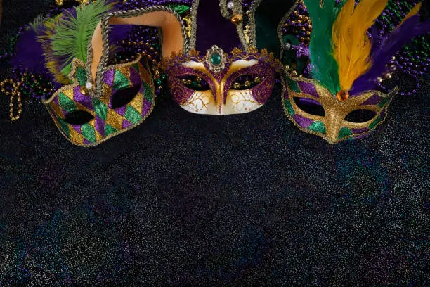 Mardi Gras Mask and colorful Mardi Gras Beads Background.