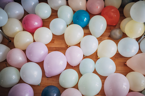 Many colorful balloons on the floor
