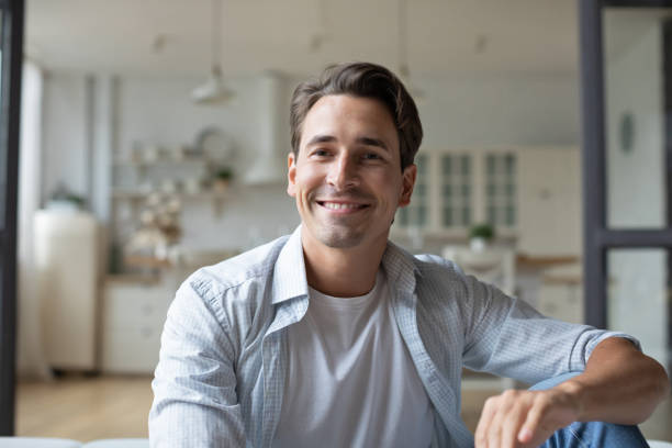 istock Guy looking at the camera online meeting with friends chat, 1364589268