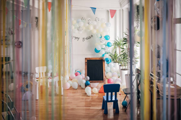 istock Happy birthday balloon decoration and empty chalkboard sign 1364591648