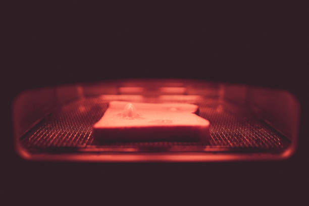 istock Of toast that is burned in the toaster image 1364591778