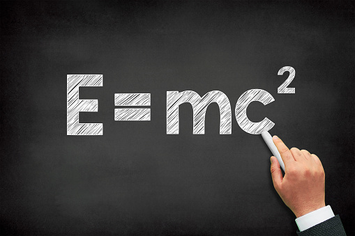 E=mc2 physical formula written on a black chalkboard, theory of relativity