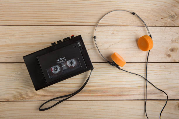 istock Old portable cassette player on a wooden background 1364595634