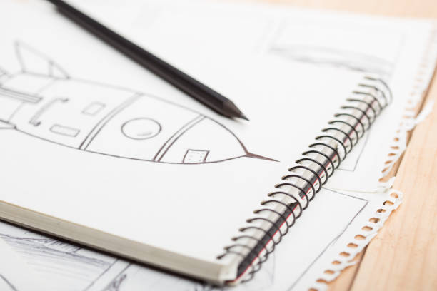 istock Artist drawing an anime comic book in a studio. 1364598063