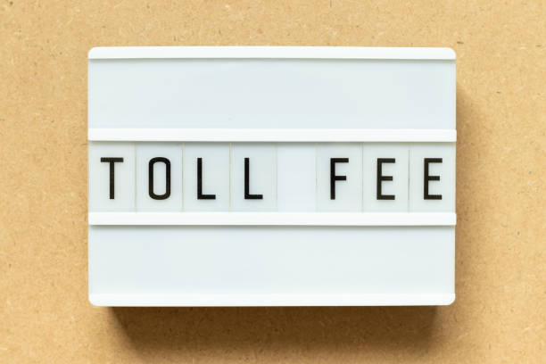 istock Lightbox with word toll fee on wood background 1364600584