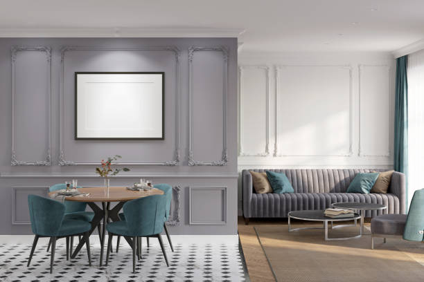 istock A classic apartment with a blank horizontal poster above the served dining table and chairs, a gray sofa with colored cushions, an armchair next to the coffee tables, a window with curtains. 1364603292