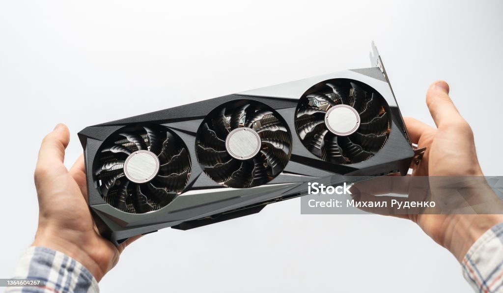 person holding a computer graphics video card. crypto mining and parts deficit Computer Graphic Stock Photo