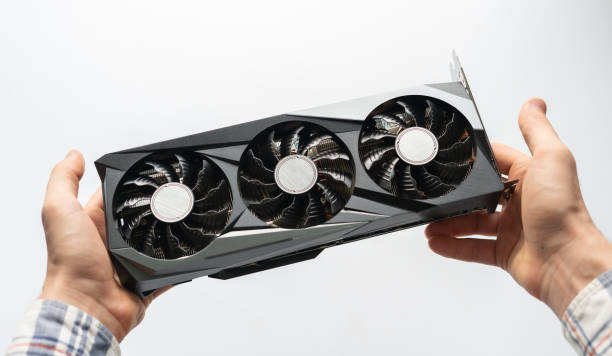 person holding a computer graphics video card. crypto mining and parts deficit stock photo