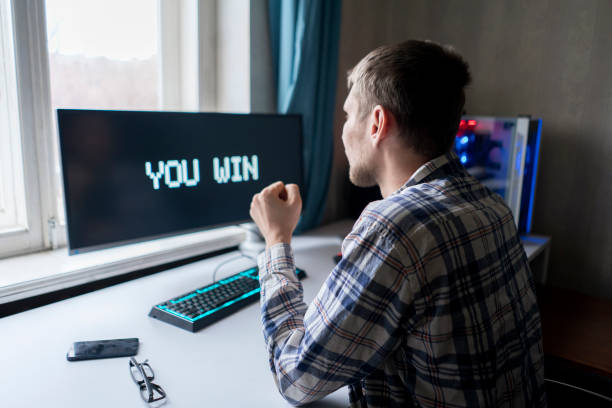 istock person playing video game showing happy emotions winning the game 1364604393