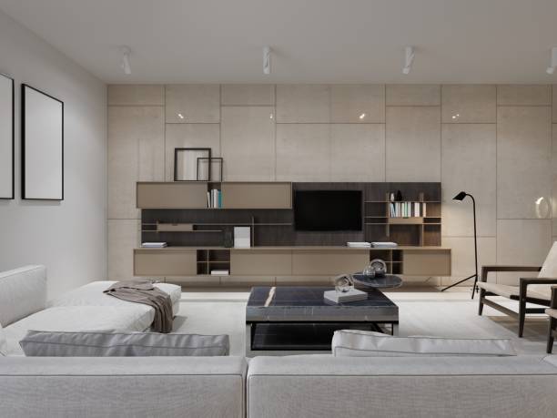 istock contemporary living with big white sofa and large beige wall system with TV. 1364604413