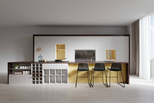 istock Contemporary white kitchen with a beautiful yellow niche and a large kitchen island with brown marble countertop 1364604477