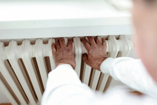istock Man checking temperature of the radiator. 1364605536