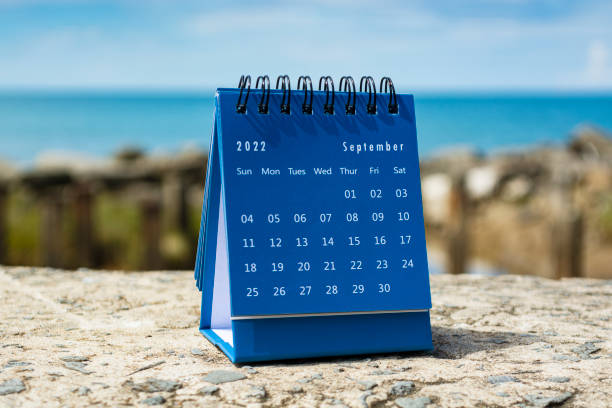 istock Blue September 2022 calendar on blurred background of blue ocean 1364606741