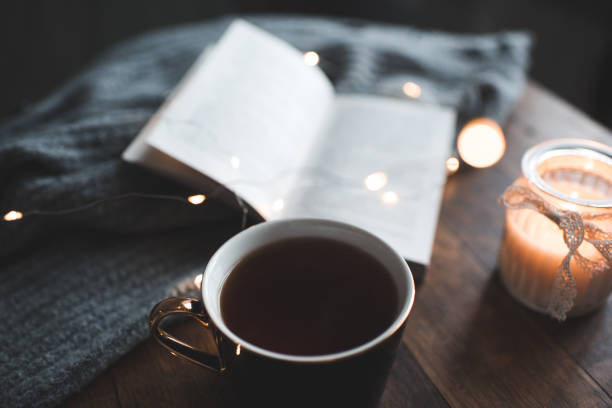 istock Cosy home atmosphere with coffee and scented candle 1364606983