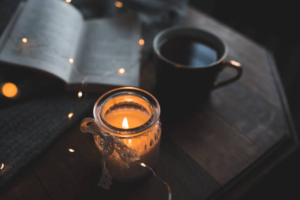 istock Cosy home atmosphere with coffee and scented candle 1364606984