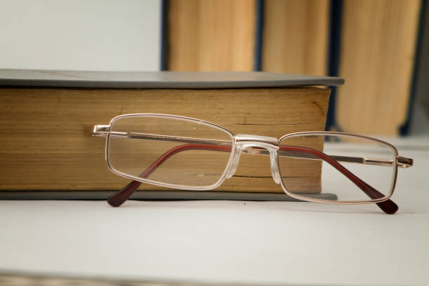 istock Reading glasses and books. 1364607966