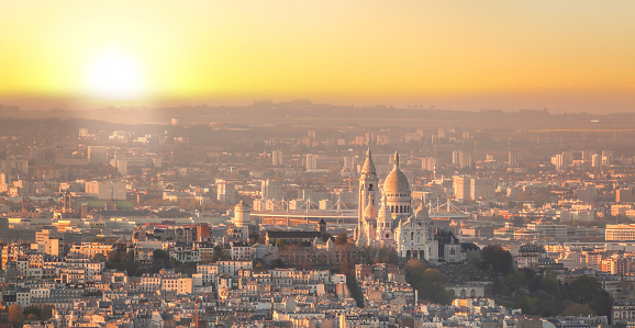 Panorama of Paris with Sacre Coeur Cathedral during golden hour in Paris, France