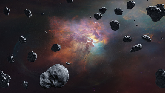 Asteroids in outer space on nebula background with starlight. Elements of this image furnished by NASA.