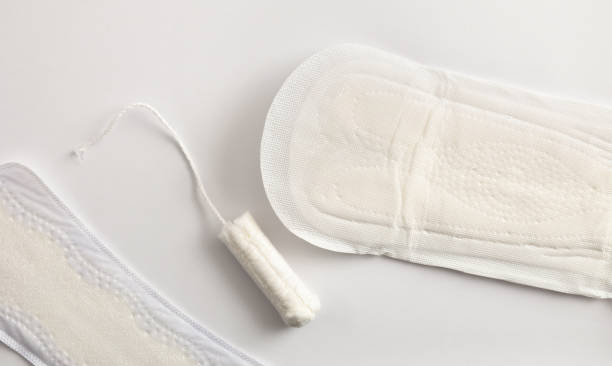 istock Background with female absorbent protectors for menstrual cycle on white 1364611016