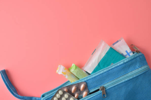 istock Toiletry bag with menstrual hygiene products top view 1364611082