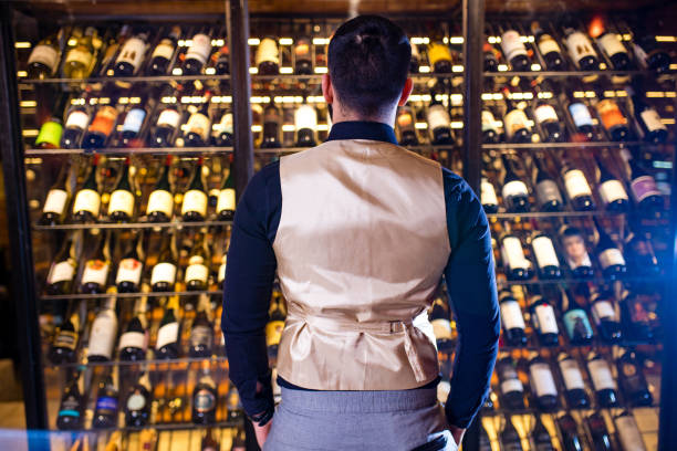 istock happy successful male winemaker is tasting a flavor and checking red wine quality 1364612859