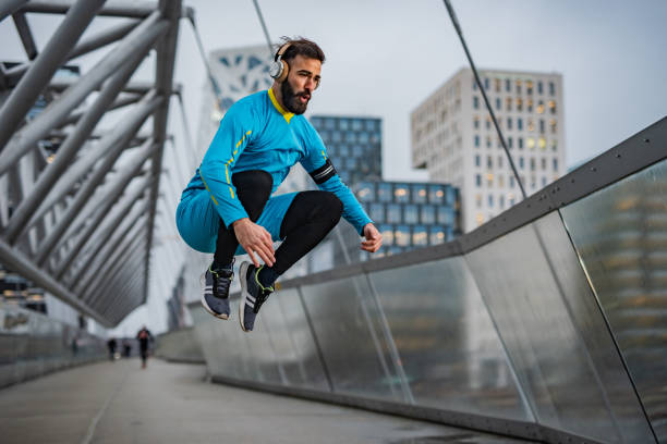 istock Athlete men jumping at bridge 1364612984