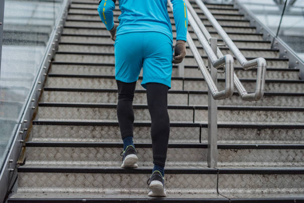 istock Athlete men running up the stairs 1364613080