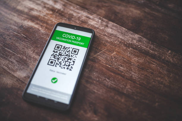 istock Phone showing Covid-19 vaccination certificate 1364613648