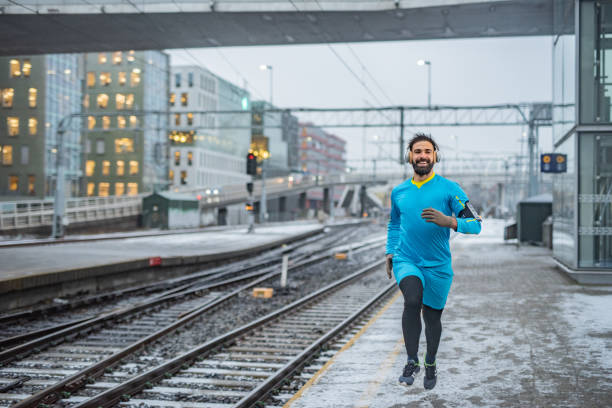 istock Athletic man running in city 1364613889