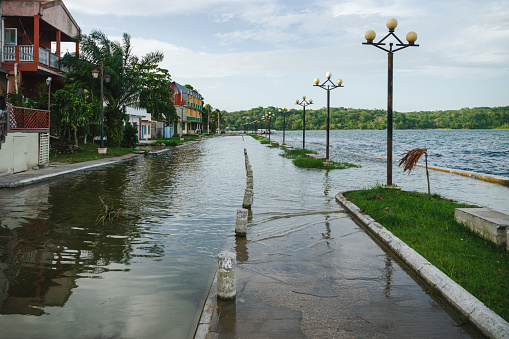 The streets along lake Itza at the island Flores are regulary flooded after rainfalls as the water level of the lake is rising, Guatemala