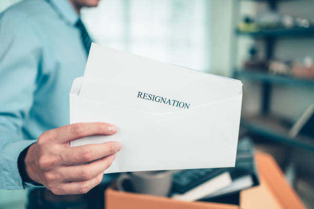 Businessman sending and showing resignation letter to employer boss. Quiting a job, businessman fired or leave a job concpet. stock photo