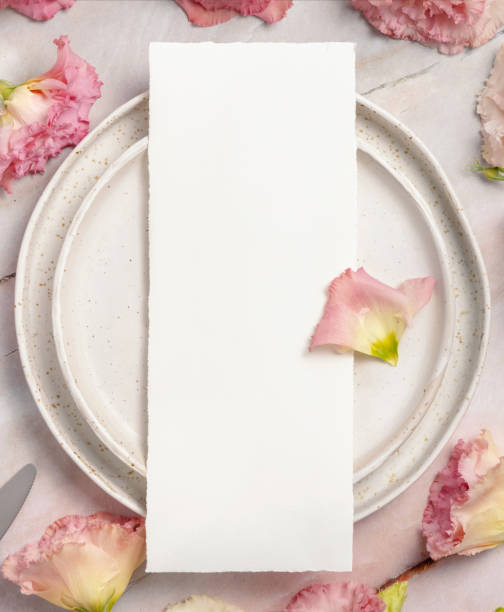 istock Wedding menu laying on a ceramic plate on a marble table 1364617161
