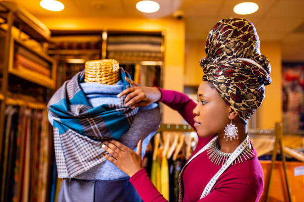 latino spain salewoman in storage update cotton and lace fabric showroom latino spain salewoman in storage update cotton and lace fabric showroom . woman tailor stock pictures, royalty-free photos & images