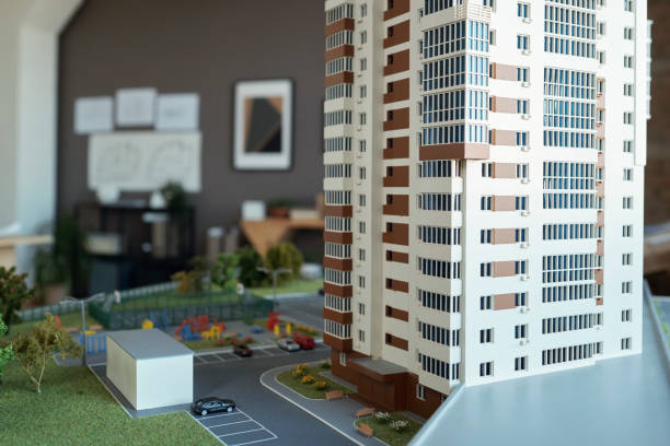 istock Layout of multi-storey house with yard at workplace of architect 1364622190