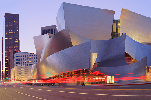 Los Angeles, California, USA - December 19, 2021: Night time view of the Disney concert hall. Designed by Frank Gehry and opened in 2003, Disney hall is one of the venue of the Music Center located on Grand Avenue in Los Angeles - home to cultural institutions and residential and office towers.