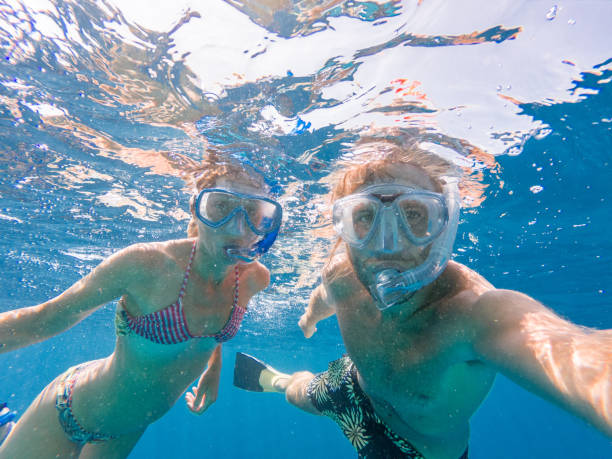 istock Young couple take selfie underwater with snorkelling mask 1364624205