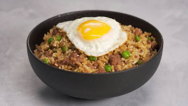 istock fried rice with minced meat. Fried rice with minced pork basil and fried egg. fried rice with fried egg 1364624836
