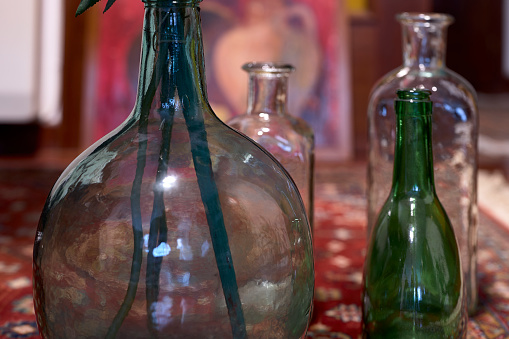 Vase and various glass bottles